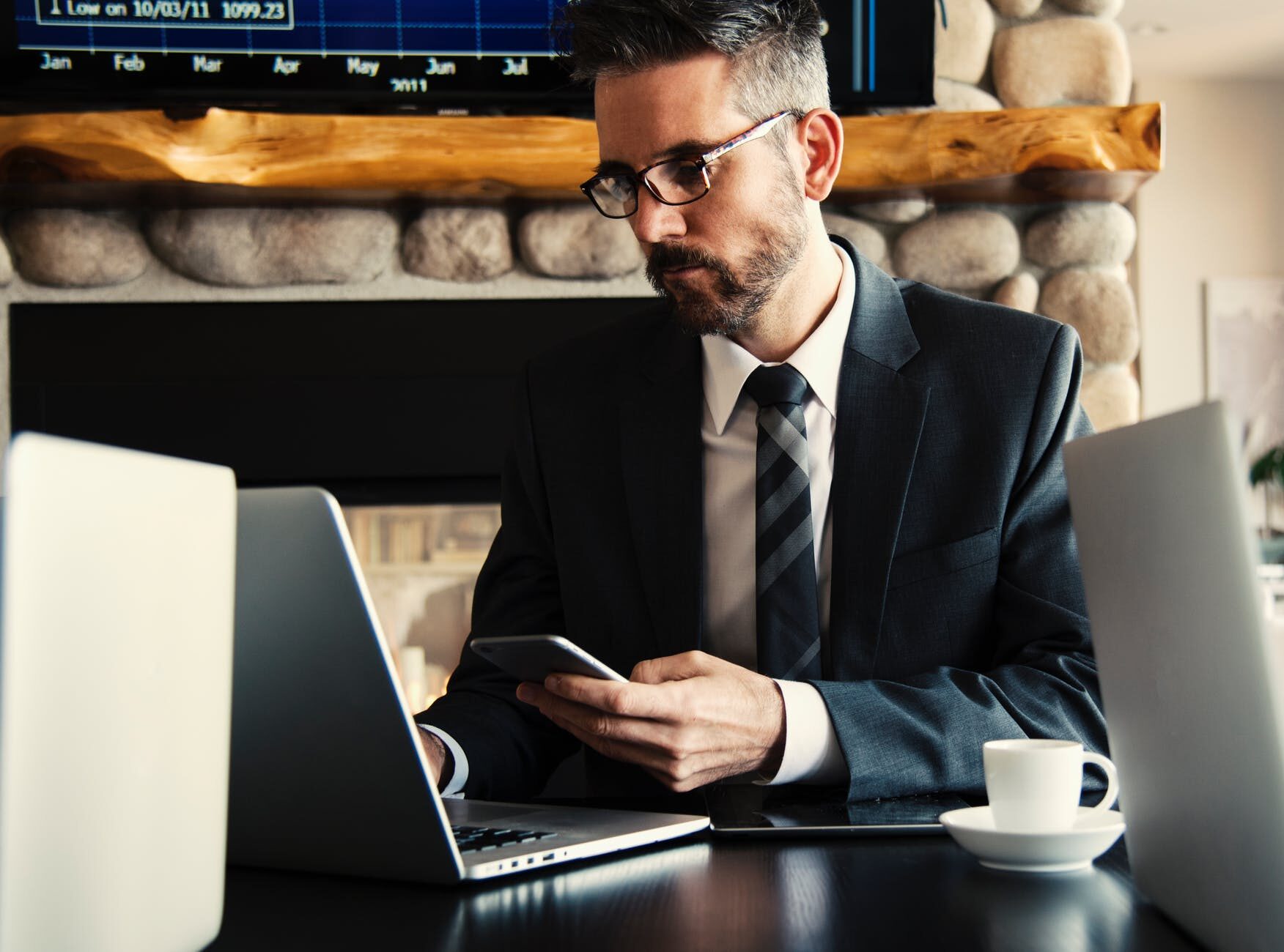 man in black holding phone